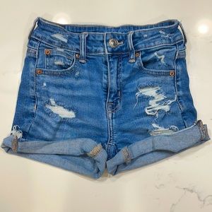 Slightly worn distressed jeans shorts